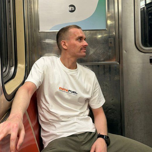 Simon Petit wearing a DataFuel shirt on the subway.